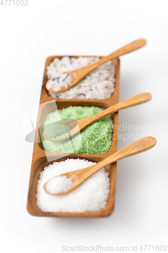 Image of sea salt and spoons on wooden tray