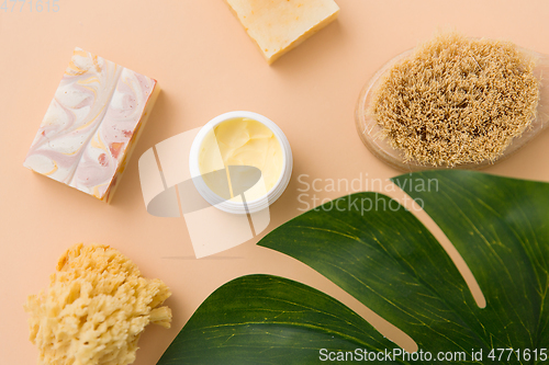 Image of natural soap, brush, sponge and body butter
