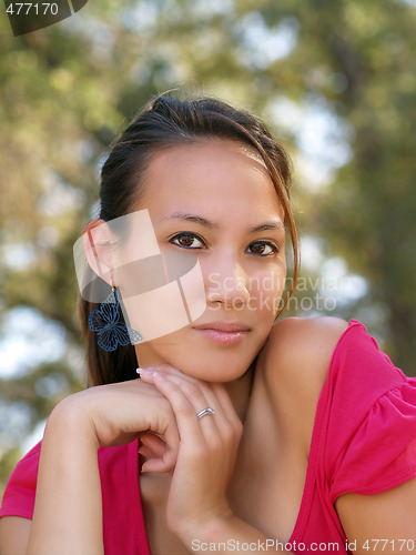 Image of Portrait of young asian american woman with hands