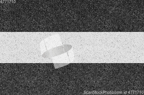 Image of Black asphalt background texture with yellow line