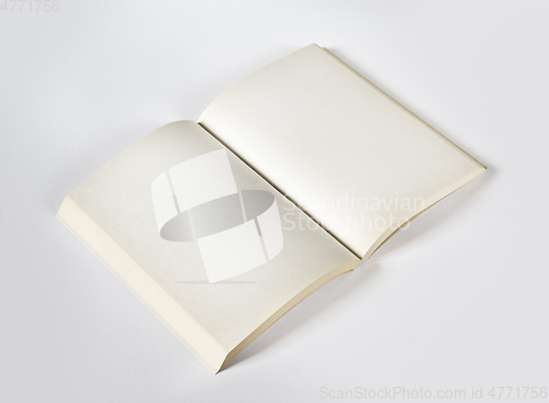 Image of Old open blank book isolated on grey