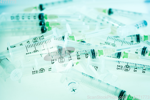 Image of Syringes on blue background