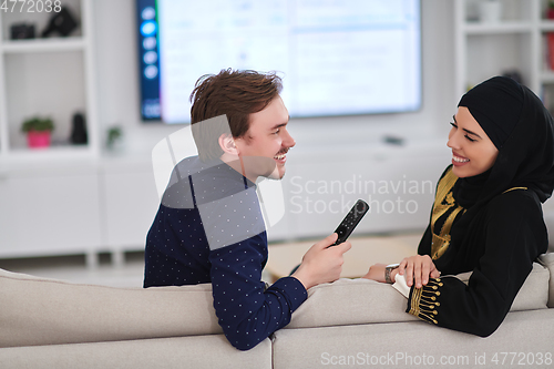 Image of Young muslim couple enjoing time together at home during Ramadan