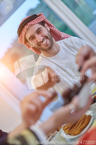 Image of Muslim family having iftar together during Ramadan.