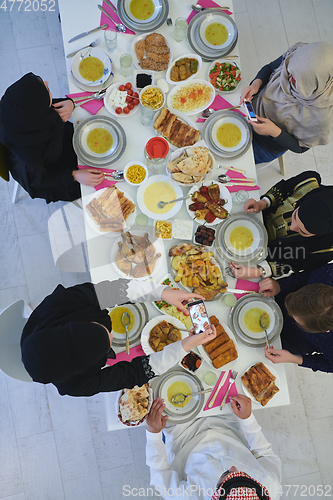 Image of Top view of muslim family having Iftar during Ramadan holy month