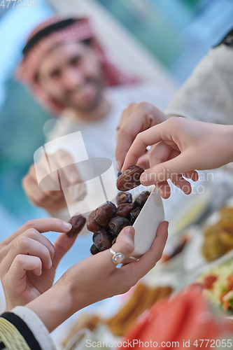 Image of Muslim family having iftar together during Ramadan.