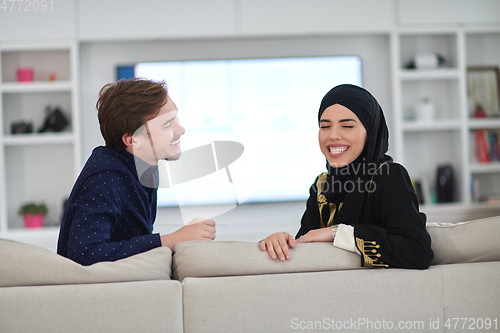 Image of Young muslim couple enjoing time together at home during Ramadan