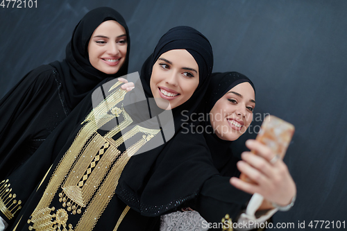 Image of Portrait of Arab women wearing traditional clothes or abaya