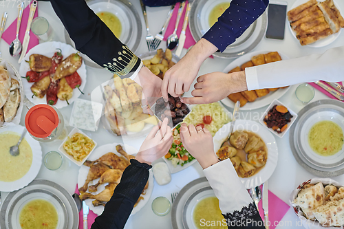 Image of Top view of muslim family having Iftar during Ramadan holy month