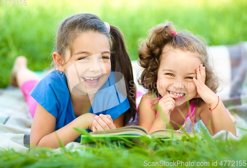 Image of Two little girls are reading book