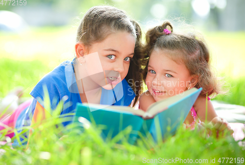 Image of Two little girls are reading book