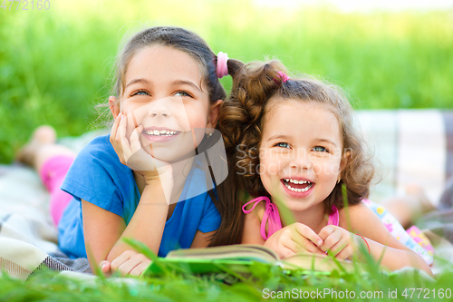 Image of Two little girls are reading book