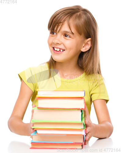 Image of Little girl with her books