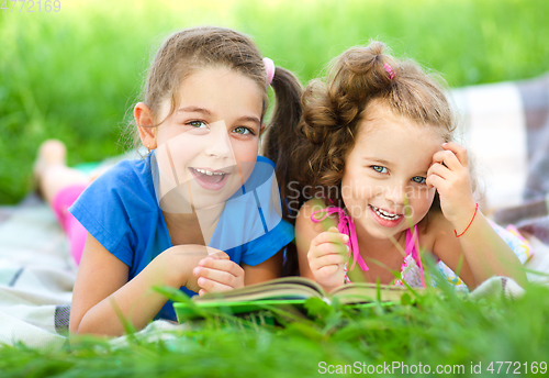 Image of Two little girls are reading book