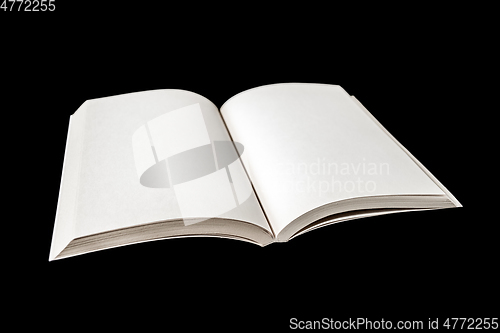 Image of Open blank book isolated on black