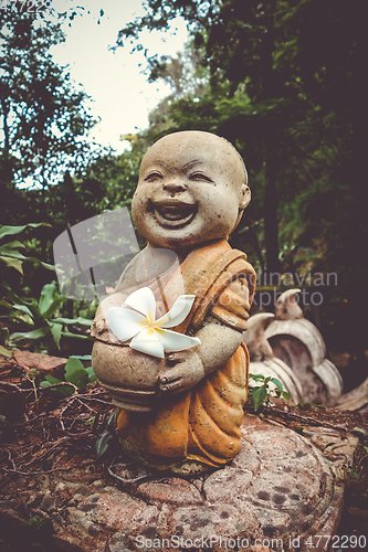 Image of Buddha statue in jungle, Wat Palad, Chiang Mai, Thailand