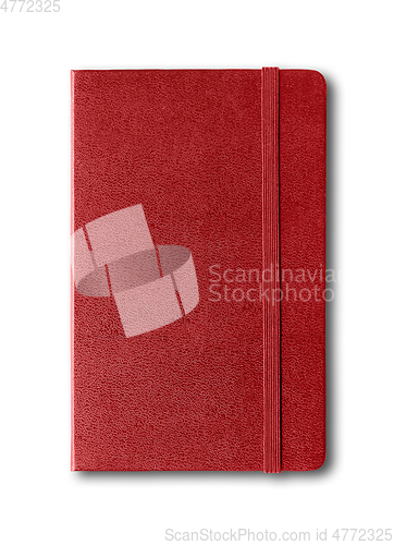 Image of Dark red closed notebook isolated on white