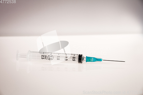 Image of Syringe on grey background