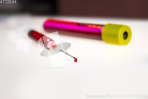 Image of Syringe needle and tube with blood