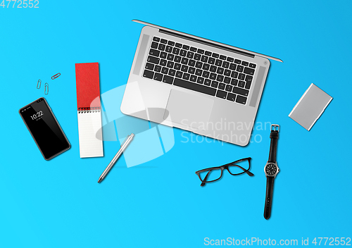 Image of Office desk mockup top view isolated on blue