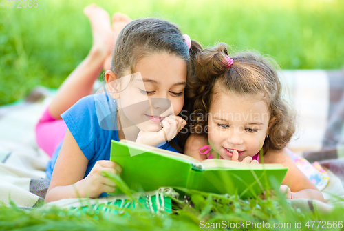 Image of Two little girls are reading book