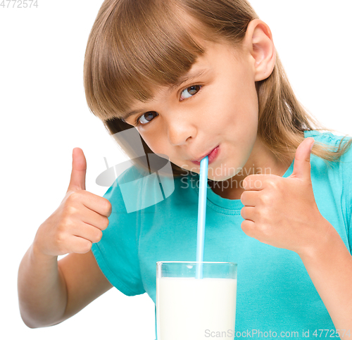 Image of Cute little girl with a glass of milk