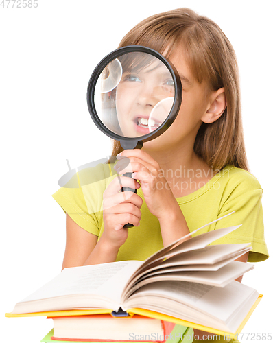 Image of Little girl is reading book