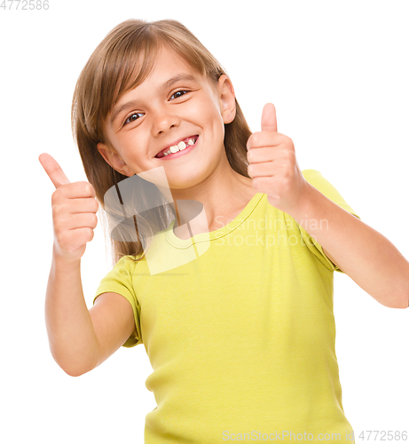 Image of Little girl is showing thumb up sign