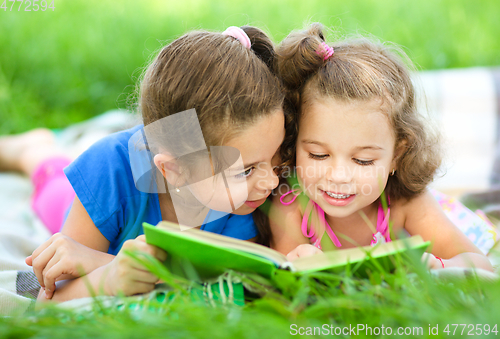 Image of Two little girls are reading book