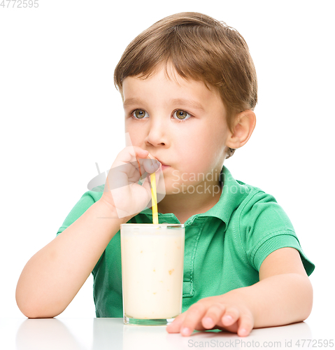 Image of Cute little boy with a glass of milk
