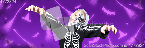 Image of Little boy like a vampire on scary purple background