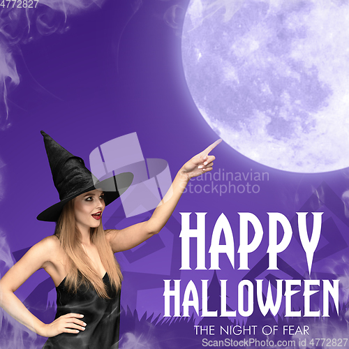 Image of Young woman in hat as a witch on purple background