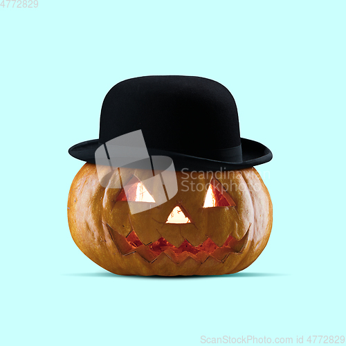 Image of Scary pumpkin on blue background, the night of fear