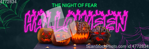 Image of Scary pumpkins on black background, the night of fear