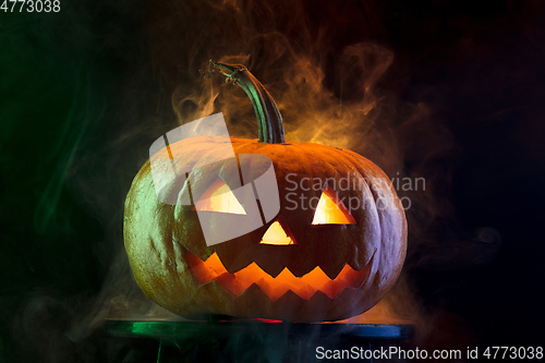 Image of Halloween pumpkin head jack lantern with scary evil face