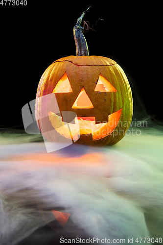 Image of Halloween pumpkin head jack lantern with scary evil face