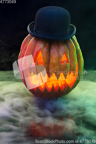 Image of Halloween pumpkin head jack lantern with scary evil face