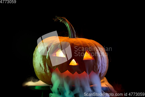 Image of Halloween pumpkin head jack lantern with scary evil face