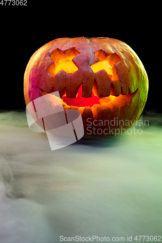 Image of Halloween pumpkin head jack lantern with scary evil face