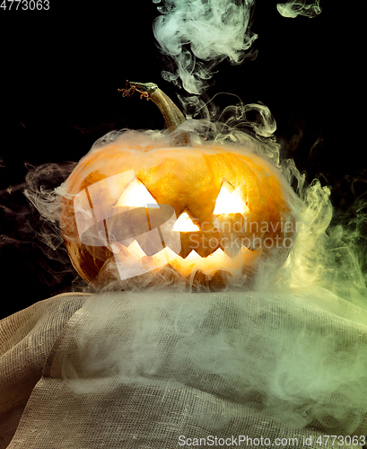 Image of Halloween pumpkin head jack lantern with scary evil face