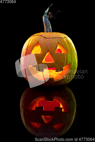 Image of Halloween pumpkin head jack lantern with scary evil face