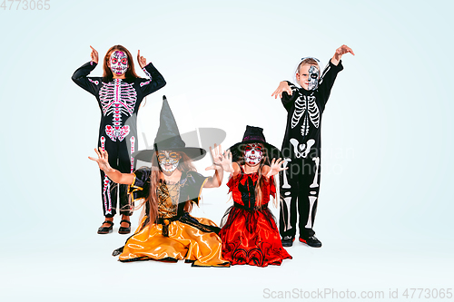 Image of Kids or teens like witches and vampires on white background