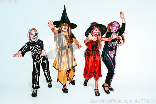 Image of Kids or teens like witches and vampires on white background