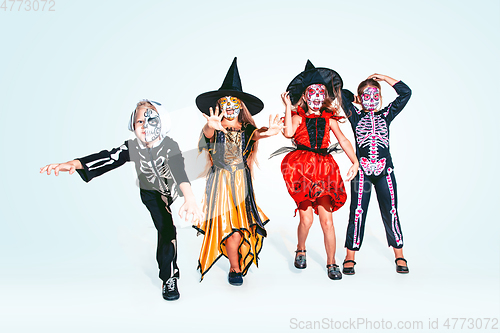 Image of Kids or teens like witches and vampires on white background
