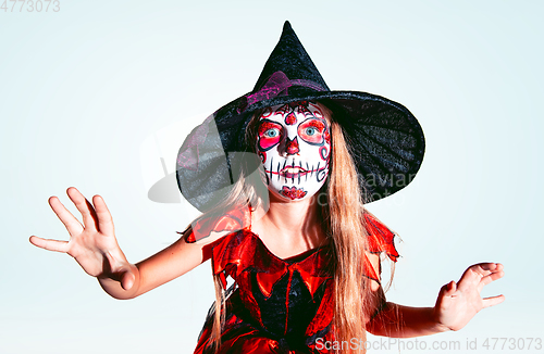 Image of Little girl like a witch on white background