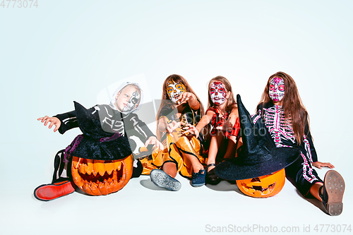 Image of Kids or teens like witches and vampires on white background