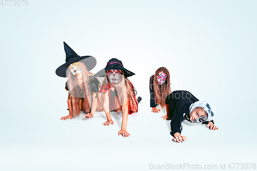 Image of Kids or teens like witches and vampires on white background