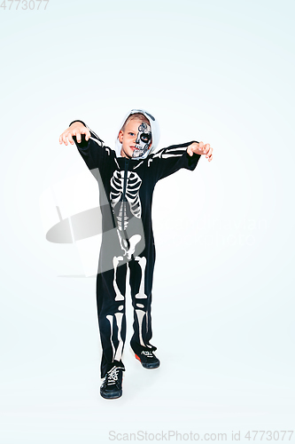 Image of Little boy like a vampire on white background