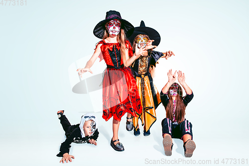 Image of Kids or teens like witches and vampires on white background