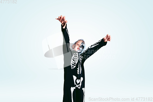 Image of Little boy like a vampire on white background